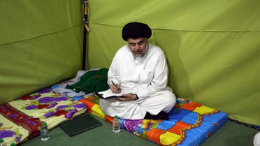 Shiite cleric Muqtada al-Sadr sits inside his tent during his sit-in inside the heavily guarded Green Zone, in Baghdad, Iraq, Sunday, March, 27, 2016. (AP)