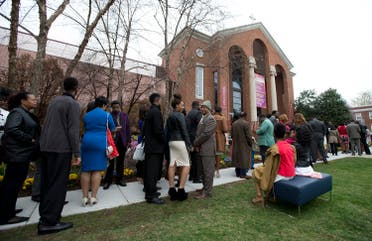 Churchgoers line up outside the historic Alfred Street Baptist Church in Alexandria, Va., Sunday, March 27, 2016, where President Barack Obama and his family joined the congregation to celebrate Easter. (AP)