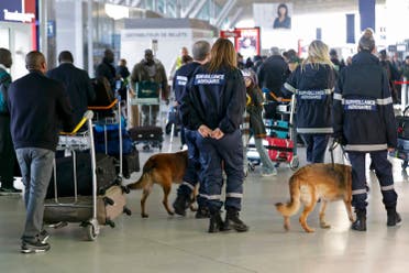 Members of airport security patrol inside the Charles de Gaulle International Airport in Roissy, near Paris, France, March 23, 2016 as France has decided to deploy 1,600 additional police officers to bolster security at its borders and on public transport following the bomb attacks in Brussels. REUTERS