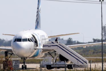 A man leaves the hijacked aircraft of Egyptair at Larnaca airport in Cyprus Tuesday, March 29, 2016. ِAP
