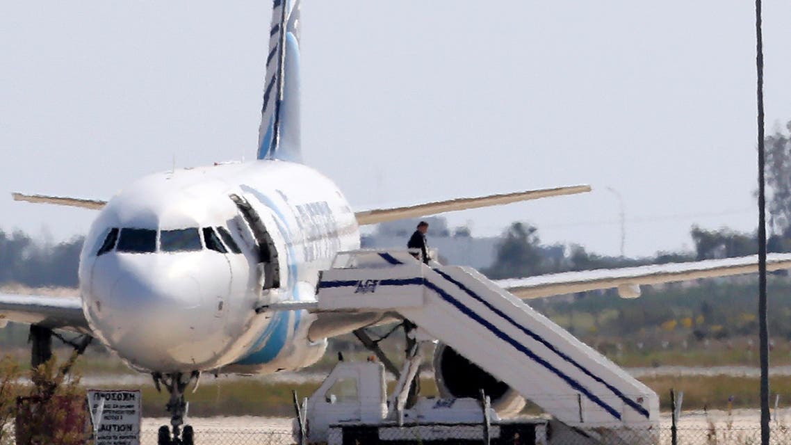 A man leaves the hijacked aircraft of Egyptair at Larnaca airport in Cyprus Tuesday, March 29, 2016. ِAP
