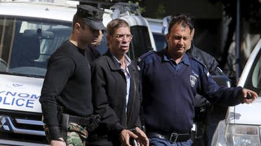 The man (C) who was arrested after he hijacked an EgyptAir flight, which was forced to land in Cyprus on Tuesday, is transferred by Cypriot police as they leave a court in the city of Larnaca, Cyprus March 30, 2016. REUTERS