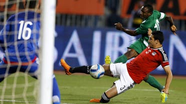 Egypt's Rami Rabia and Nigeria’s Aminu Umar in action. REUTERS