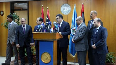 Fayez Al-Sarraj, flanked by members of the Presidential Council, speaks during a news conference at the Mitiga Naval Base in Tripoli, Libya, Wednesday, March, 30, 2015. AP