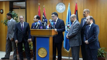 Fayez Al-Sarraj, flanked by members of the Presidential Council, speaks during a news conference at the Mitiga Naval Base in Tripoli, Libya, Wednesday, March, 30, 2015. AP