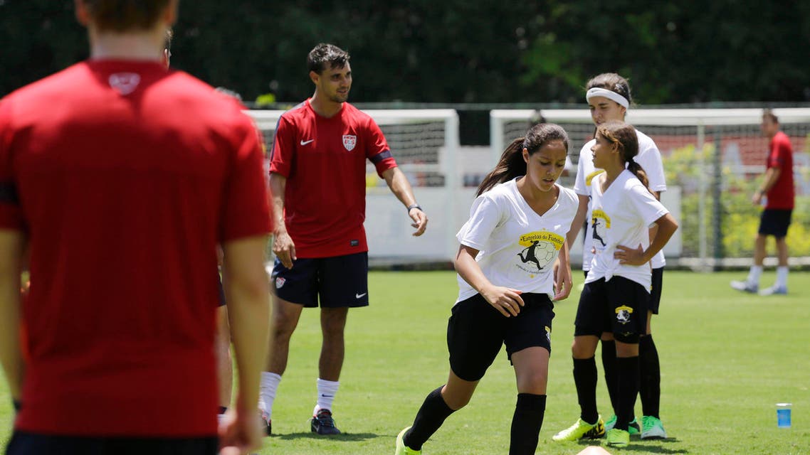 Young female players take part in a program coined "Sports for All" organized by the US Consulate which gives public school kids soccer and English lessons, with the U.S. national soccer team in Sao Paulo, Brazil, Wednesday, Jan. 22, 2014. AP