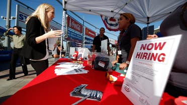 People browse booths at a military veterans' job fair in Carson, California, in this file photo taken October 3, 2014. U.S. employment gains surged in February, the clearest sign yet of labor market strength that could further ease fears the economy was heading into recession and allow the Federal Reserve to gradually raise interest rates this year. REUTERS