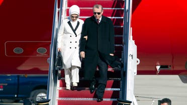 Turkish President Recep Tayyip Erdogan accompanied by his wife Emine walk down the stairs upon his arrival at Andrews Air Force Base, Md., Tuesday, March 29, 2016. (AP)