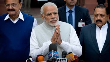 Indian Prime Minister Narendra Modi, center, with his cabinet colleagues greet the media as he arrives on the opening day of budget session of the Indian parliament in New Delhi, India, Tuesday, Feb. 23, 2016. The budget session of the parliament which focus largely on the financial business of the government began Tuesday and the Union Budget will be presented on Feb. 29. (AP)