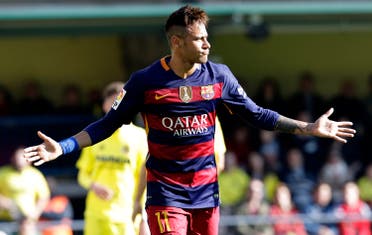 Barcelona's Neymar celebrates after scoring during the Spanish La Liga soccer match between Villarreal and Barcelona at the Madrigal stadium in Villarreal, Spain, Sunday, March 20, 2016. (AP)