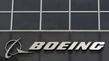 The Boeing logo is seen at their headquarters in Chicago, in this April 24, 2013 file photo. Boeing Co plans to cut up to 8,000 jobs this year at its commercial airplane division, according to two people familiar with the matter, a move that could slash $1 billion in costs and help it battle for sales against European rival Airbus. Boeing on March 30, 2016 acknowledged plans to cut about 4,000 jobs in its commercial airplanes division by mid-year, and another 550 jobs in a unit that conducts flight and lab testing. REUTERS