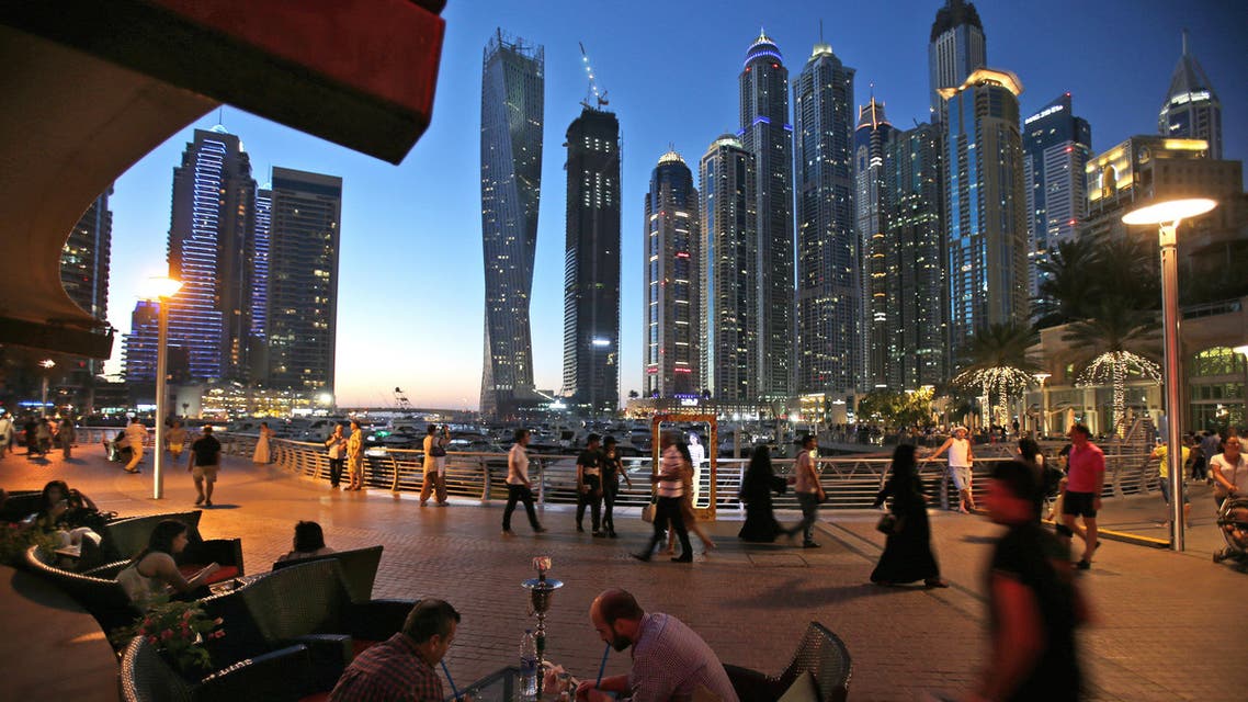 In this May 1, 2015 photo, two men play backgammon while smoking a water pipe at a restaurant overlooking an upmarket neighborhood. (AP)