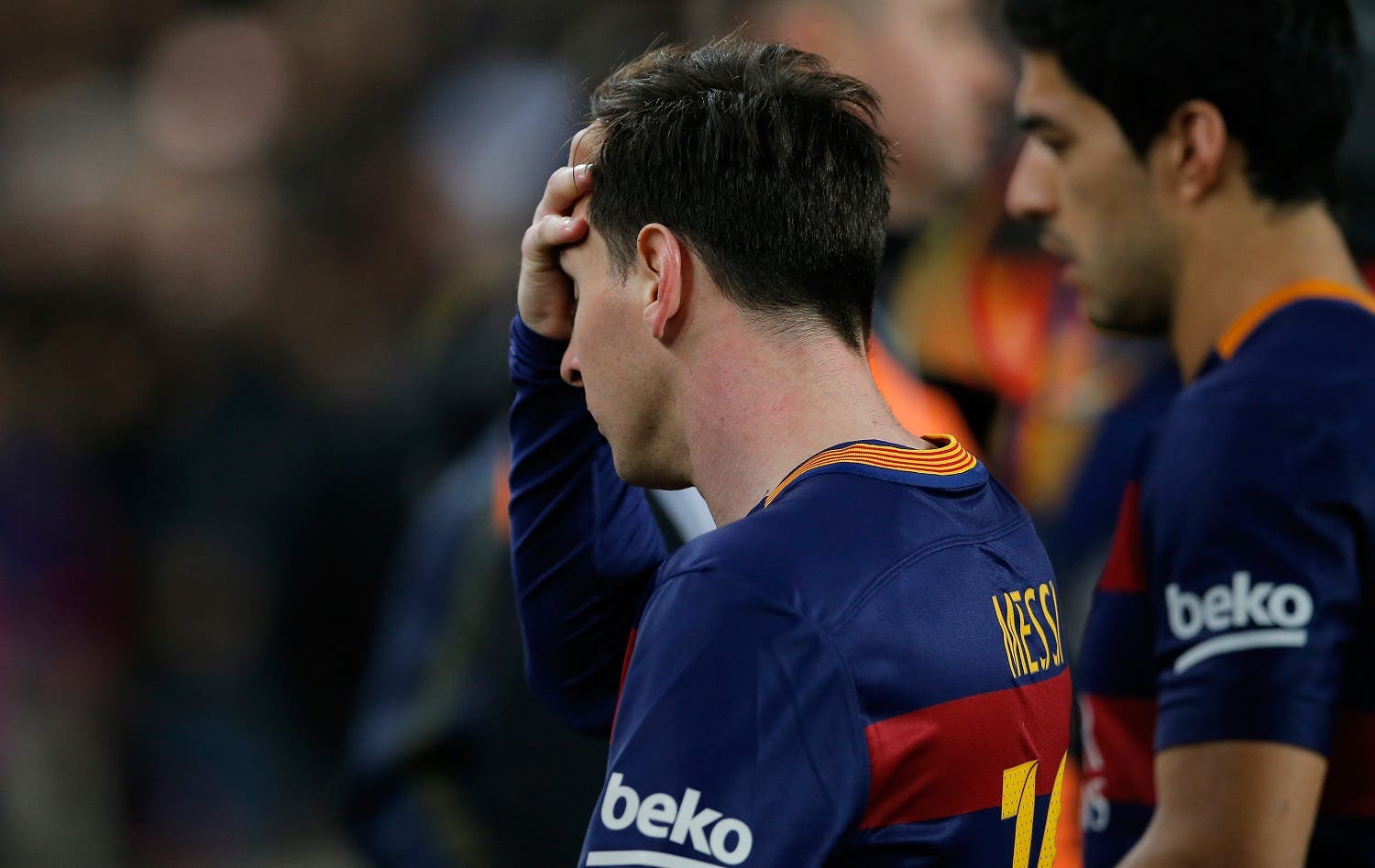Barcelona's Lionel Messi and Luis Suarez, right, leave the pitch at the end of a Spanish La Liga soccer match between Barcelona and Real Madrid, dubbed 'el clasico', at the Camp Nou stadium in Barcelona, Spain, Saturday, April 2, 2016. Real Madrid won 2-1. (AP)