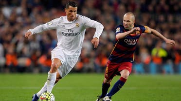 Real Madrid's Cristiano Ronaldo, left, drives the ball past Barcelona's Andres Iniesta during a Spanish La Liga soccer match between Barcelona and Real Madrid, dubbed 'el clasico', at the Camp Nou stadium in Barcelona, Spain, Saturday, April 2, 2016. (AP)