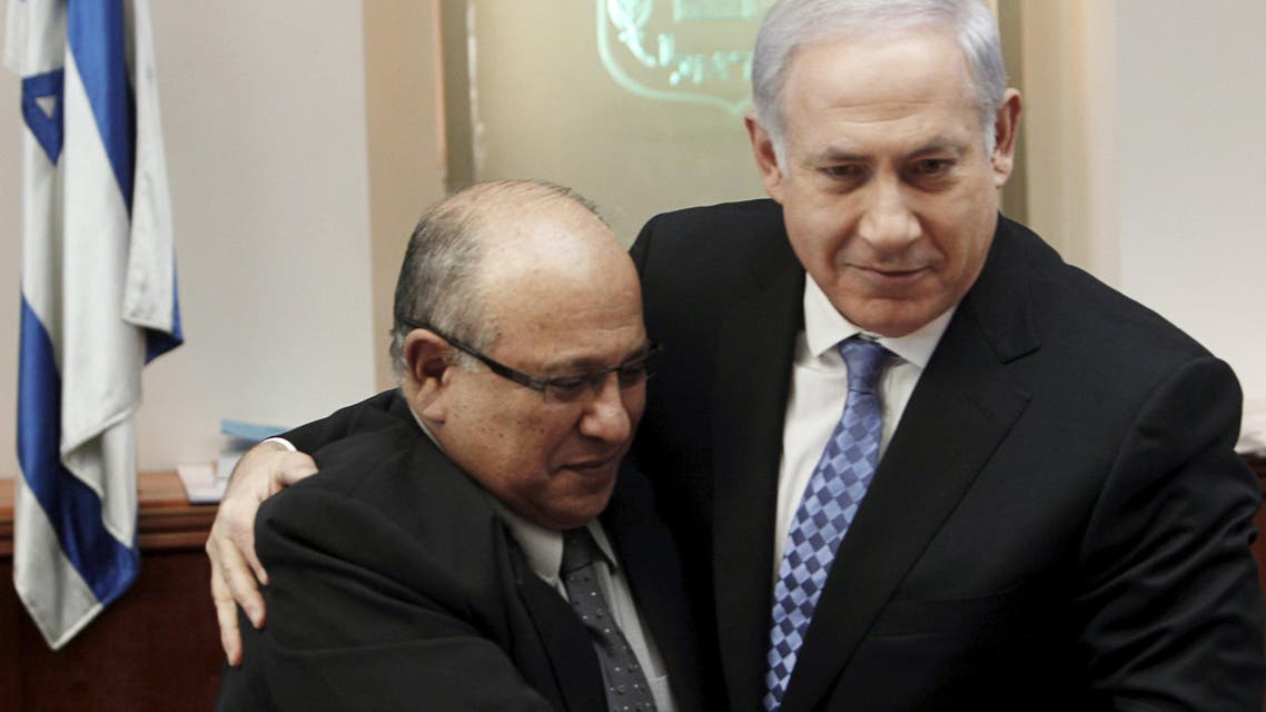 Israel's Prime Minister Benjamin Netanyahu (R) hugs Meir Dagan, the outgoing director of Israel's spy agency Mossad, after thanking him at the beginning of the weekly cabinet meeting in Jerusalem, in this file picture taken January 2, 2011. REUTERS/Ronen Zvulun/Files