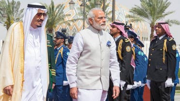 Saudi King Salman walks with India's Prime Minister Narendra Modi during an official welcoming ceremony in Riyadh. (SPA)