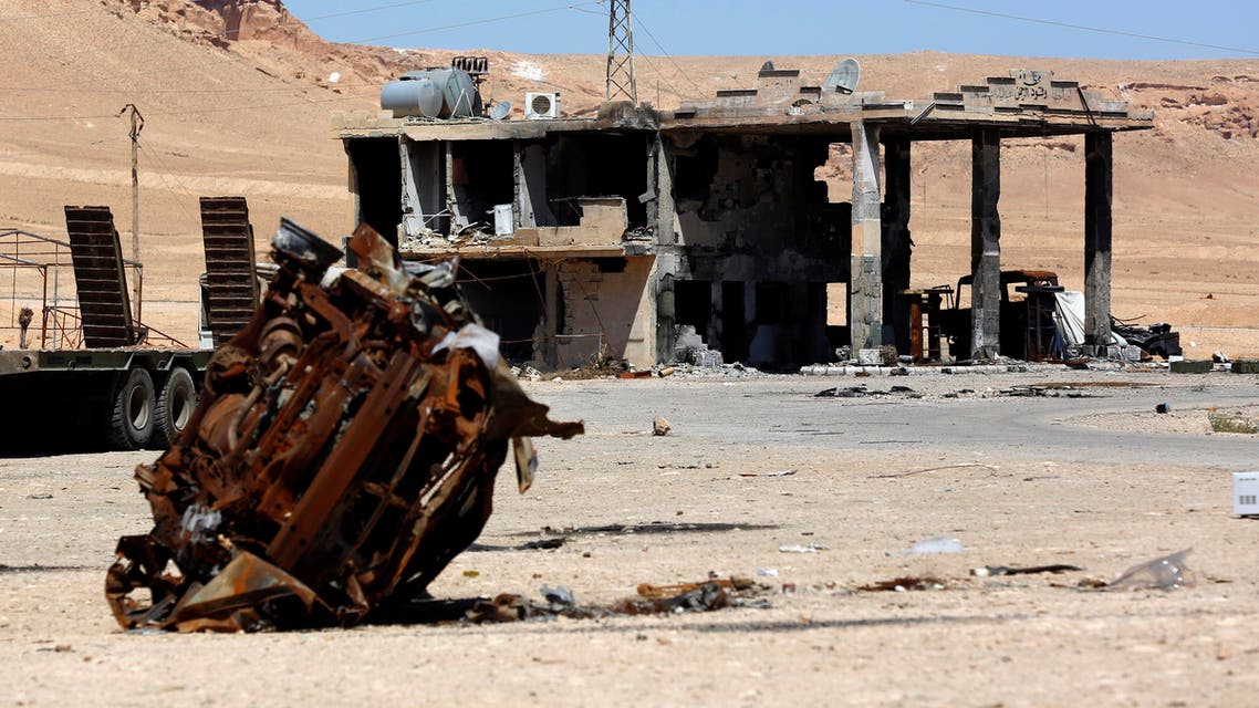Torched cars are seen in the ancient city of Palmyra, Syria, on Friday, April 2, 2016. (AP)