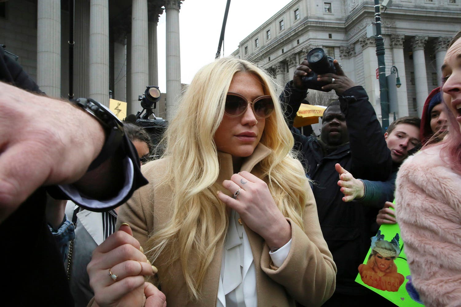 In this Feb. 19, 2016 file photo, pop star Kesha leaves Supreme court in New York after a hearing involving her producer, Dr. Luke. About 35 Kesha fans gathered outside Sony’s Manhattan headquarters on Friday, March 11, to deliver petitions with more than 411,000 signatures demanding that the label release Kesha from her Sony recording contract and drop the producer, Dr. Luke, who she has accused of raping her. The hit-making producer, born Lukas Gottwald, is not charged with any crime. (AP)