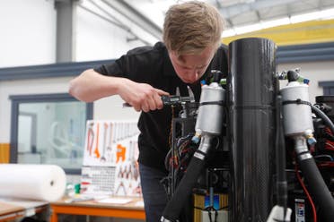 In this Feb. 9, 2016 photo, technician Simon Jones works on a jetpack at the Martin Aircraft Co. headquarters in Christchurch, New Zealand. The company says it’s close to commercial liftoff, but the man who started it fears his vision of a personal jetpack will remain grounded. (AP)