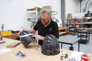 In this Feb. 9, 2016 photo, technician John Newell works on a jetpack component at the Martin Aircraft Co. headquarters in Christchurch, New Zealand. The company says it’s close to commercial liftoff, but the man who started it fears his vision of a personal jetpack will remain grounded. (AP)