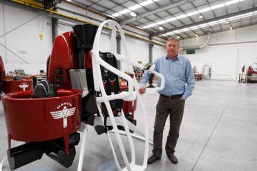 In this Feb. 9, 2016 photo, Martin Aircraft CEO Peter Coker stands next to a Martin Jetpack in Christchurch, New Zealand. The company says it’s close to commercial liftoff, but the man who started it fears his vision of a personal jetpack will remain grounded. (AP)