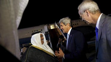 Bahrain's Foreign Minister Khalid bin Ahmed Al Khalifa (L) and U.S. Ambassador to Bahrain William Roebuck (R) greet US Secretary of State John Kerry. (Reuters)