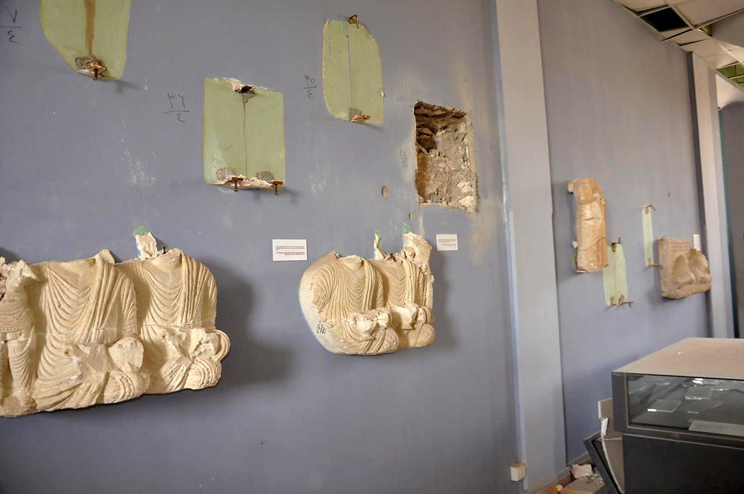 A view shows damaged artefacts inside the museum of the historic city of Palmyra, after forces loyal to Syria's President Bashar al-Assad recaptured the city, in Homs Governorate in this handout picture provided by SANA on March 27, 2016. REUTERS/SANA