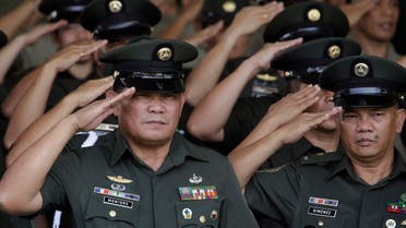 Philippine Army officers salute during ceremonies at the 119th founding anniversary of the Philippine Army in suburban Taguig, south of Manila, Philippines on Tuesday, March 22, 2016. Under the administration of Philippine President Benigno Aquino III, the Philippine military continues to it's modernization program as it deals with major security concerns, including Communist and Muslim insurgencies and South China Sea territorial disputes involving China, the Philippines and four other governments. (AP Photo/Aaron Favila)
