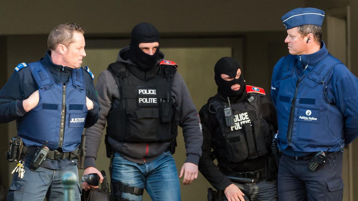Policemen stand guard as terror suspect Salah Abdeslam's case appears in court at a justice building in Brussels on Thursday, April 7, 2016.