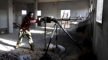 In this picture taken Thursday, March 10, 2016, fighters against the Islamic State group fire weapons in the Hawari area, south-west of the city of Benghazi, Libya. (AP)