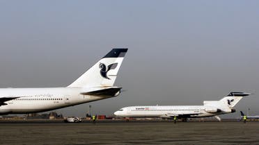 In this Sunday, March 2, 2008 photo, two passenger planes of Iran's national air carrier, Iran Air, are parked at the Mehrabad Airport in Tehran, Iran. 