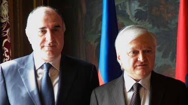 Azerbaijan's Foreign Minister Elmar Mammadyarov, left, and his Armenia's counterpart Eduard Nalbandian pose for a family photo during the CIS foreign ministers meeting in Moscow, Russia, on Friday, April 8, 2016.