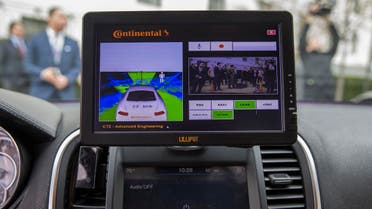 A display inside a Tesla Model 90D during a demonstration of self driving car technology on Capitol Hill, on Tuesday, March 15, 2016, in Washington. (AP Photo/Evan Vucci)