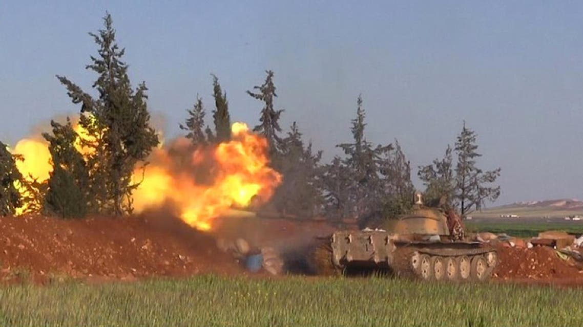 This image posted on the Twitter page of Syria's al-Qaida-linked Nusra Front on Friday, April 1, 2016, shows Nusra Front tank fires at Syrian troops and pro-government gunmen in the northern village of al-Ais in Aleppo province, Syria. ap