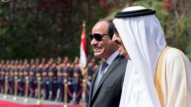 Egypt's President Abdel Fattah al-Sisi and Saudi Arabia's King Salman review the honour guards in Cairo, Egypt, in this handout photo received April 7, 2016.