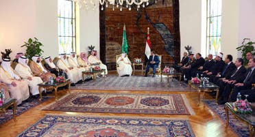 In this picture taken Friday, April 8, 2016, provided by the office of the Egyptian Presidency, Egyptian President Abdel-Fattah el-Sissi, right, sits with Saudi Arabia's King Salman in Cairo, surrounded by delegations from the two countries. (AP)