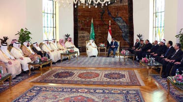 In this picture taken Friday, April 8, 2016, provided by the office of the Egyptian Presidency, Egyptian President Abdel-Fattah el-Sissi, right, sits with Saudi Arabia's King Salman in Cairo, surrounded by delegations from the two countries. (AP)