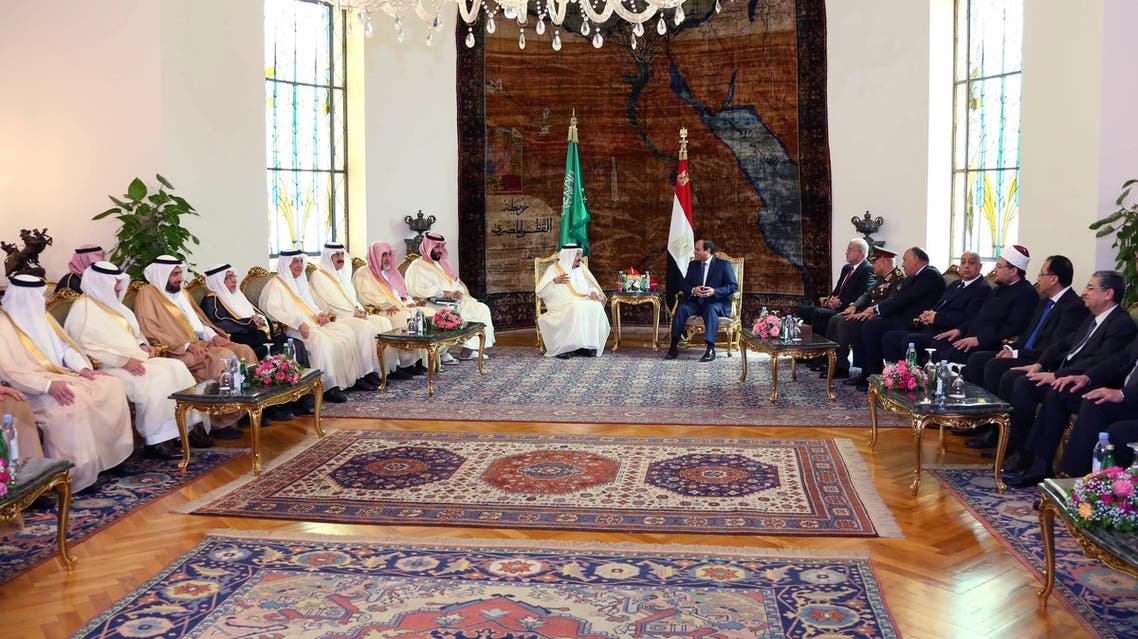 In this picture taken Friday, April 8, 2016, provided by the office of the Egyptian Presidency, Egyptian President Abdel-Fattah el-Sissi, right, sits with Saudi Arabia's King Salman in Cairo, surrounded by delegations from the two countries. (AP)