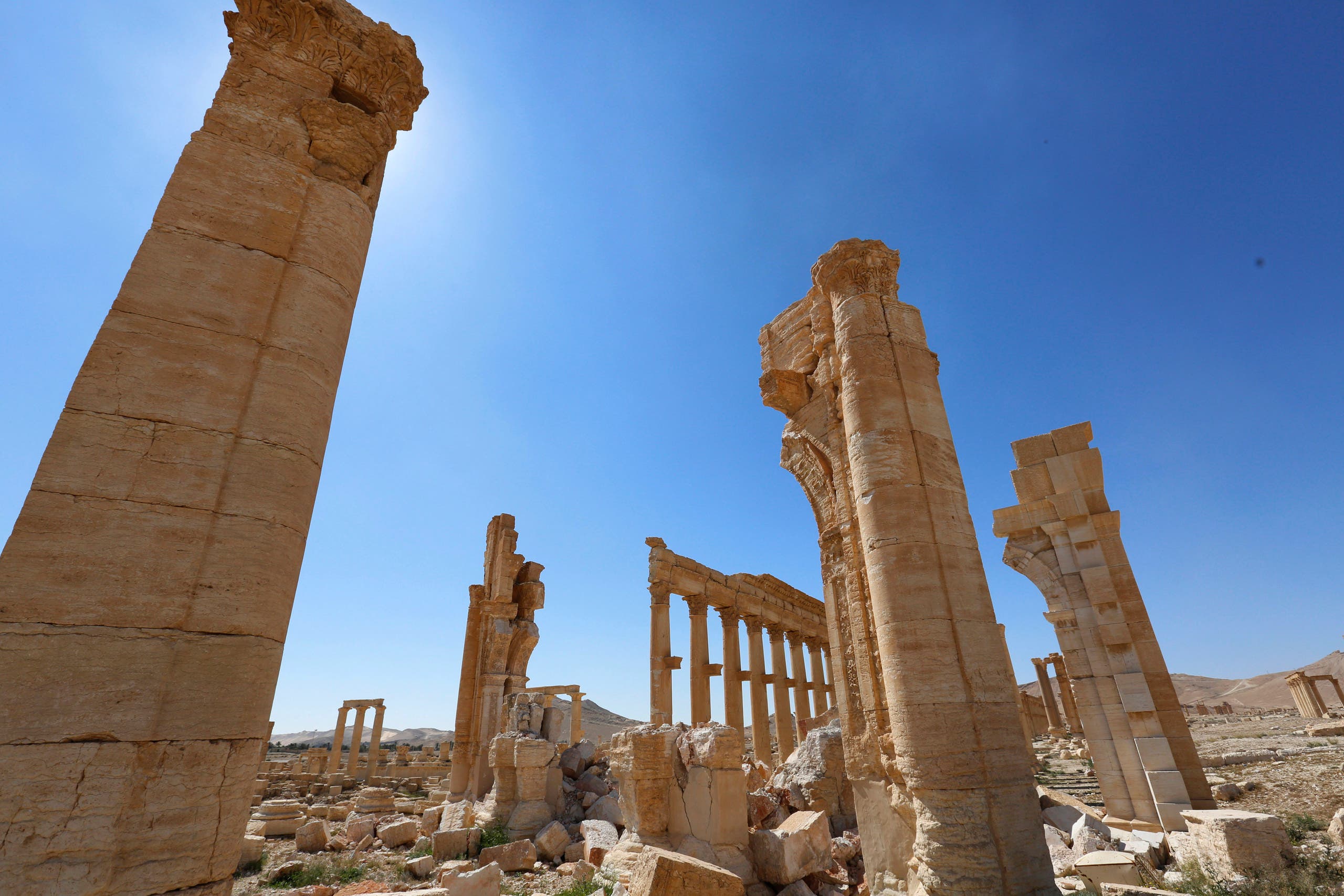 In this picture taken Friday, April 1, 2016, damage is seen near the Arch of Triumph in the ancient city of Palmyra in the central city of Homs, Syria. (AP)