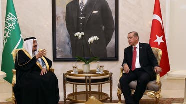 Turkish President Recep Tayyip Erdogan, right, and Saudi Arabia's King Salman speak at Esenboga Airport in Ankara, Turkey, Monday, April 11, 2016. (AP)