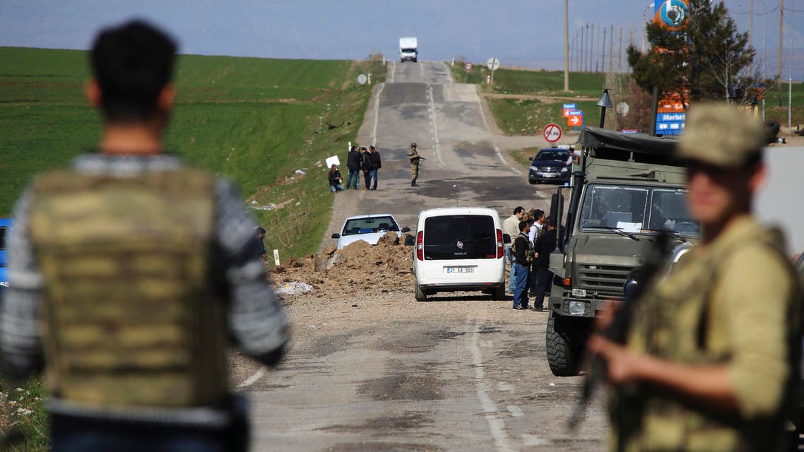 Members of Turkish forces secure the scene of an explosion on the road linking the cities of Diyarbakir and Bingol, in southeastern Turkey, Thursday, Feb. 18, 2016. Six soldiers were killed after PKK rebels detonated a bomb on the road as their vehicle was passing by, according to Turkey’s state-run Anadolu Agency.The deaths come a day after a suicide bombing claimed the lives of at least 28 people and wounded dozens of others. (AP Photo/Mahmut Bozarslan)
