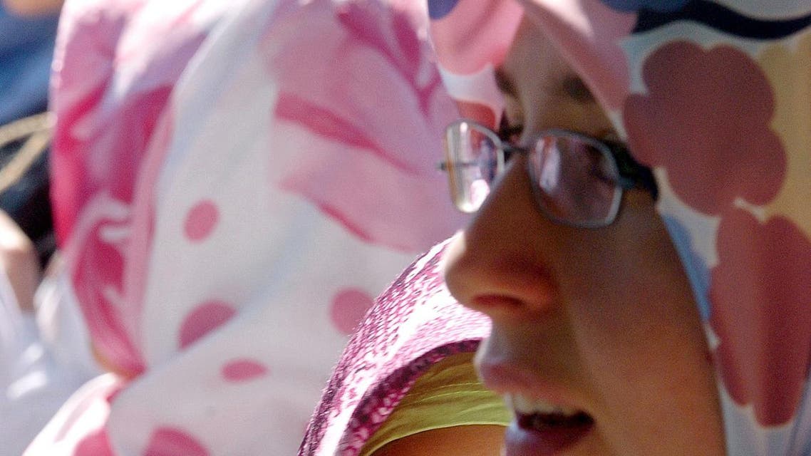 Muslim students gather in front of the Strasbourg Education Offices, eastern France, Wednesday, Sept. 1, 2004, to protest against the law banning the wearing of Islamic headscarves and other religious signs in French public schools.