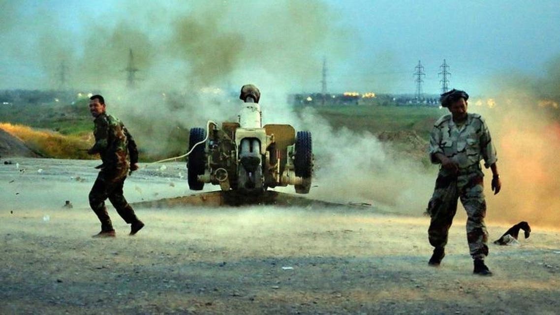 Iraqi Security forces and allied Popular Mobilization forces fire towards positions in the Islamic State group held town of Besher, during a military operation to regain control of the small town, outside the oil-rich city of Kirkuk on Monday, April 11, 2016. (AP)