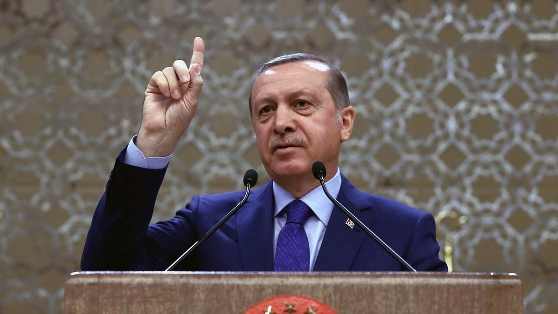 Turkish President Recep Tayyip Erdogan addresses a meeting of local administrators in Ankara, Turkey, Wednesday, April 6, 2016. Turkey's Justice Minister Bekir Bozdag says the government will work on a regulation that would allow authorities to strip Turks deemed to be supporting terrorism of their Turkish citizenship. Bozdag's comments on Wednesday came a day after Erdogan called for such a measure to strengthen Turkey's fight against terrorism.(Yasin Bulbul/Presidential Press Service, Pool via AP)
