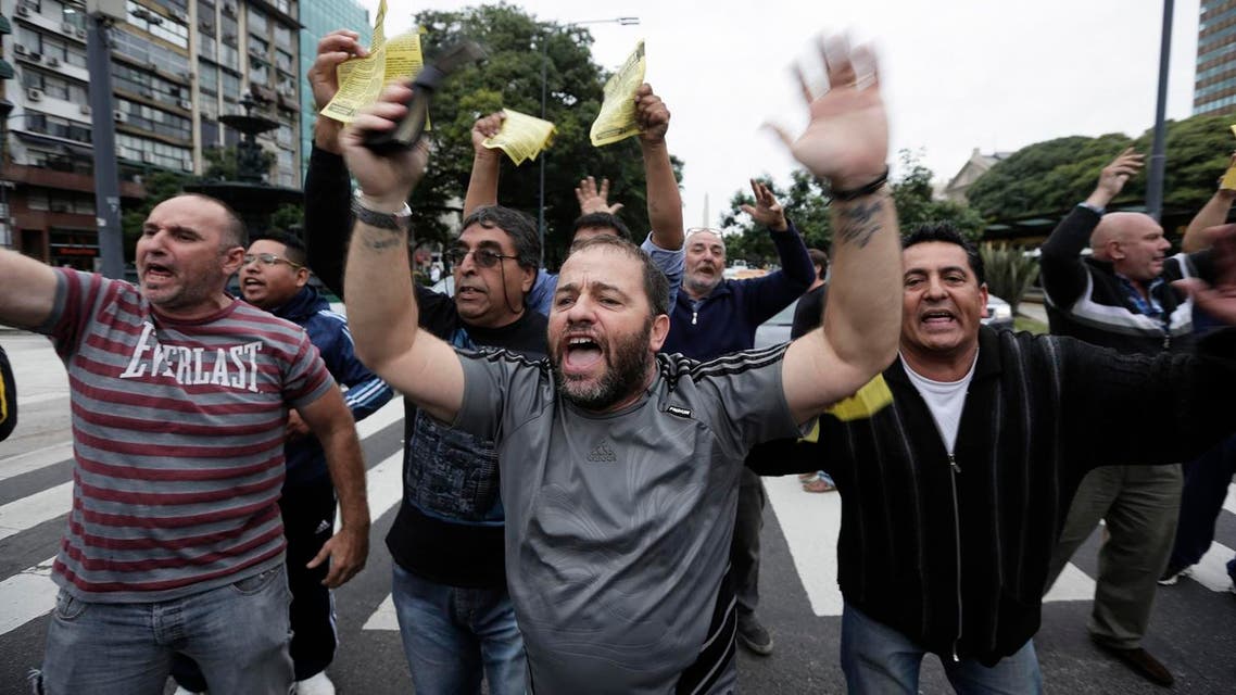 Taxi drivers block a main avenue to protest Uber in Buenos Aires, Argentina, Tuesday, April 12, 2016. (AP)