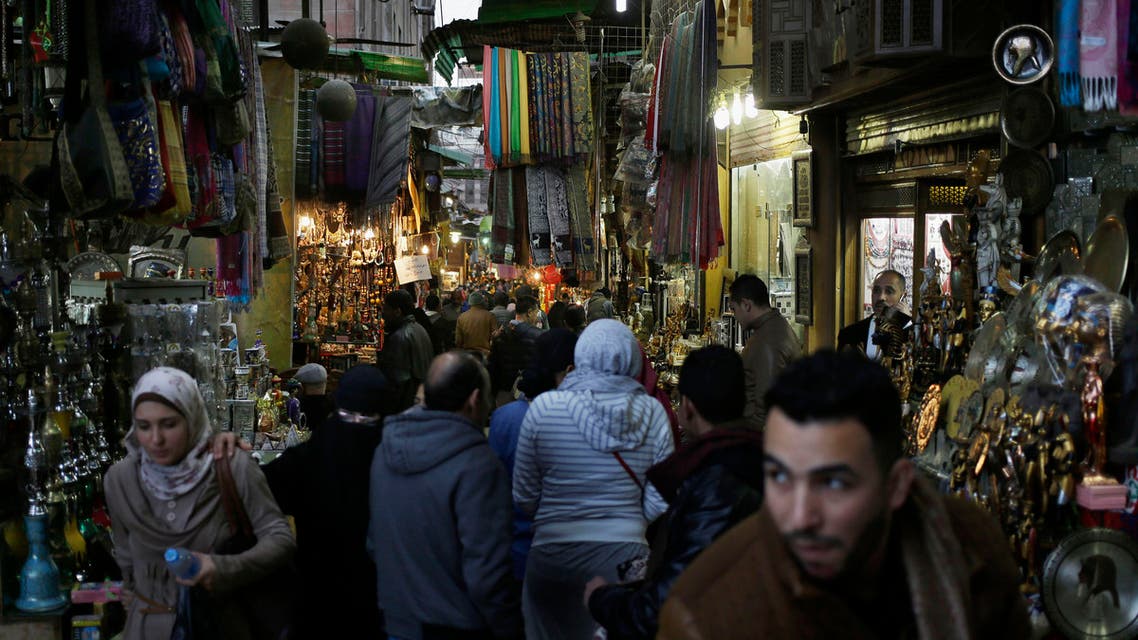 In this Friday, Feb. 20, 2015 file photo, foreigners and Egyptians stroll through the Khan el-Khalili market in Cairo, Egypt.