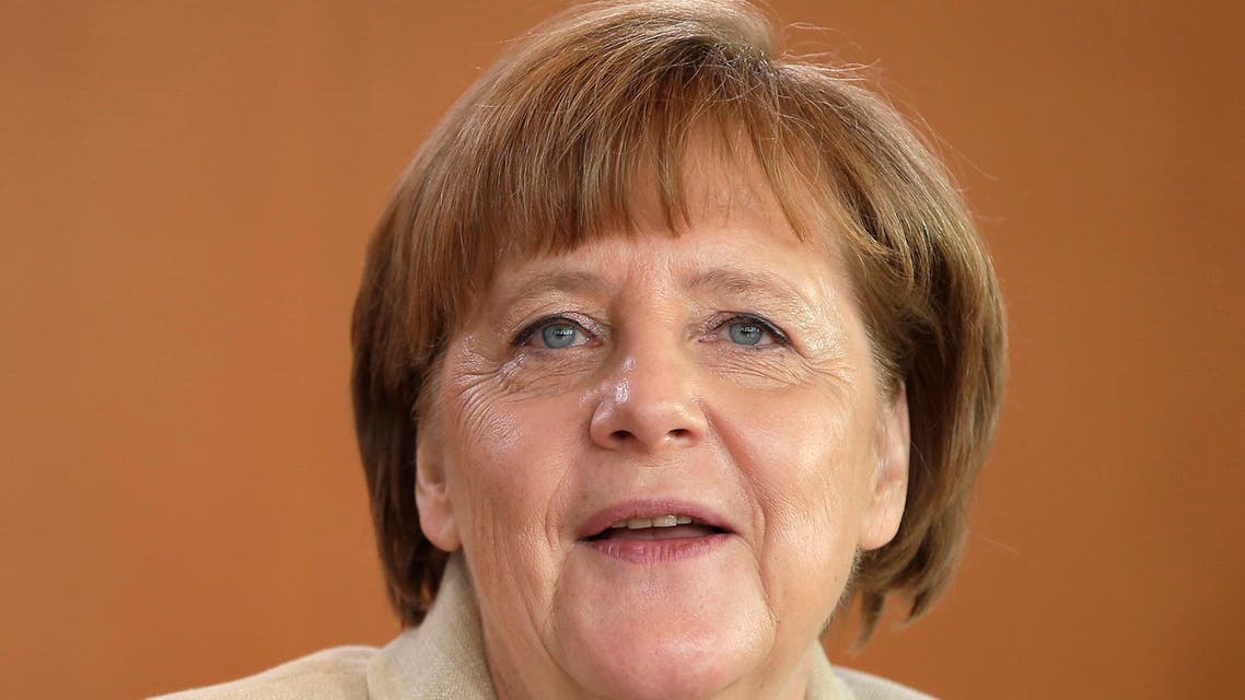 German Chancellor Angela Merkel smiles as she arrives for the weekly cabinet meeting at the Chancellery in Berlin, Germany, Wednesday, April 13, 2016. (AP)