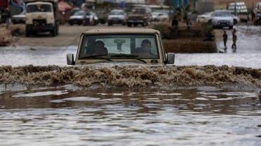 A motorist drives in floodwaters after a heavy rain in Sanaa, Yemen, Wednesday, April 13, 2016. (AP)