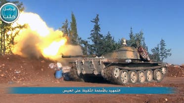 This image posted on the Twitter page of Syria's al-Qaada-linked Nusra Front on Friday, April 1, 2016, shows a Nusra Front tank firing at Syrian troops and pro-government gunmen in the northern village of al-Ais in Aleppo province, Syria.  (AP)