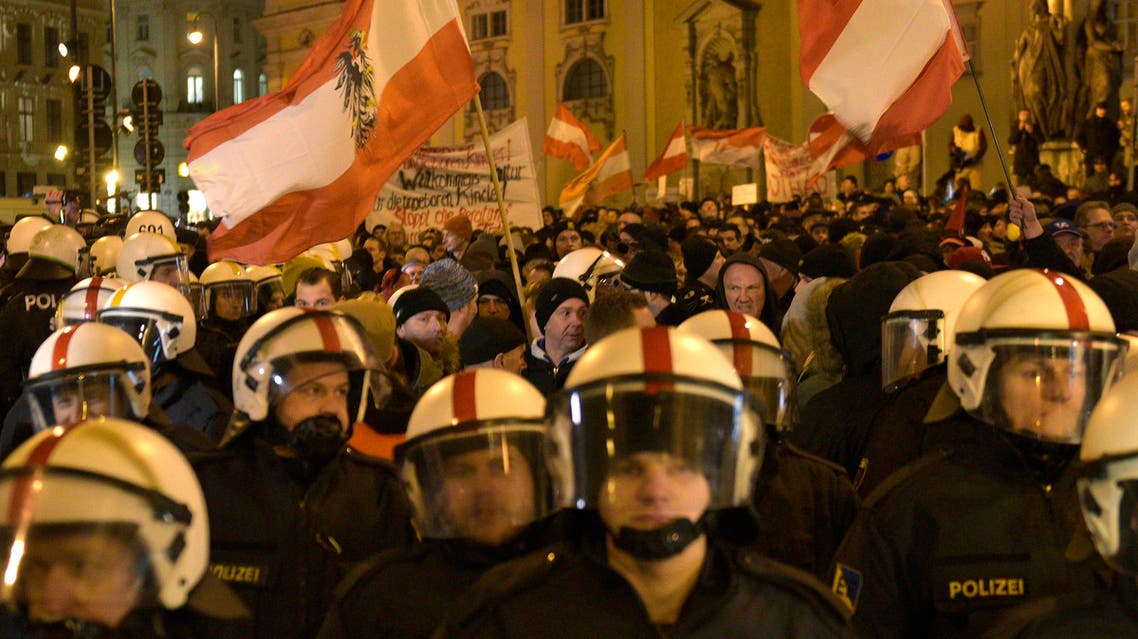 Demonstrators wave flags and show banners during a rally of the group Patriotic Europeans against the Islamization of the West, or PEGIDA, in Vienna, Austria, Monday, Feb. 2, 2015. (AP)